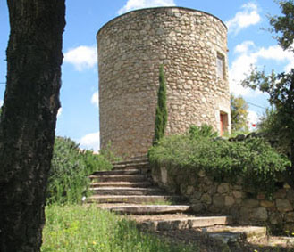 Rosemary lined steps leading up to the round tower.